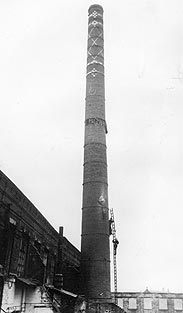 A mill chimney is demolished